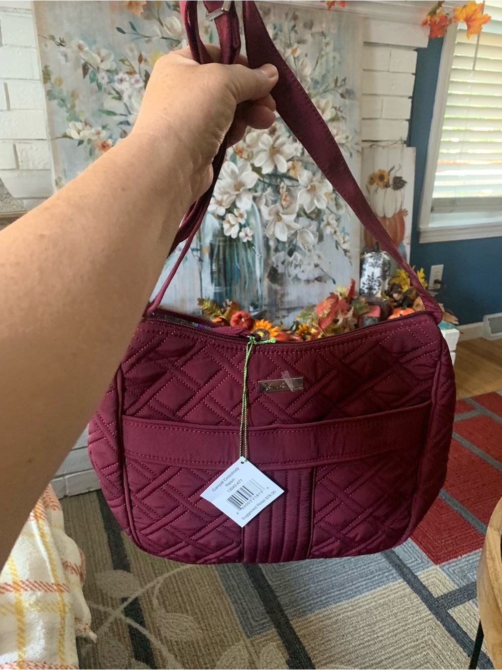 Vera Bradley’s Carryall Crossbody Raisin 13543-477 with Matching Wallet, $65.00